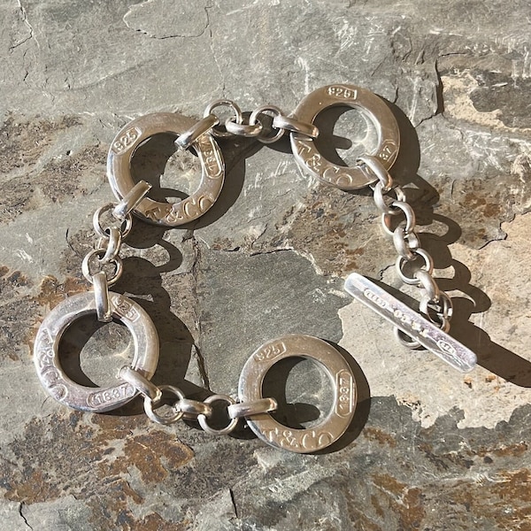 Bracelet Tiffany and Company en argent sterling T&CO 1837 à quatre anneaux
