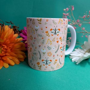 Illustrated mug, tea cup, spring bird butterfly flower motif
