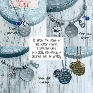 May include: A close-up of various silver and gold charm bracelets and necklaces. The charms are round and feature different sayings, including "Do More of What Makes You Happy", "Be a Sunflower", and "Behind You All Your Memories, Before You All Your Dreams".