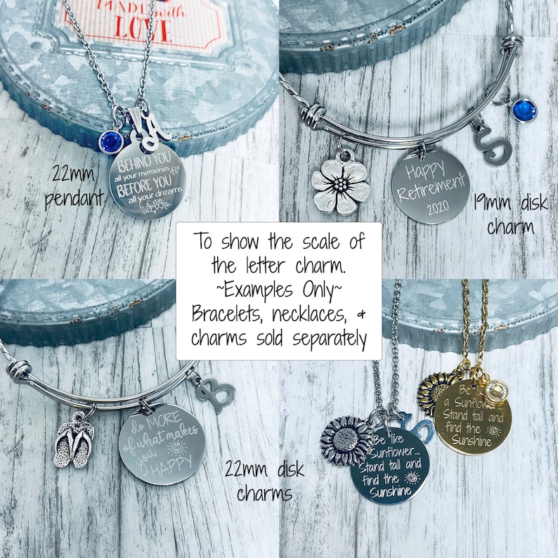 May include: A close-up of various silver and gold charm bracelets and necklaces. The charms are round and feature different sayings, including "Do More of What Makes You Happy", "Be a Sunflower", and "Behind You All Your Memories, Before You All Your Dreams".