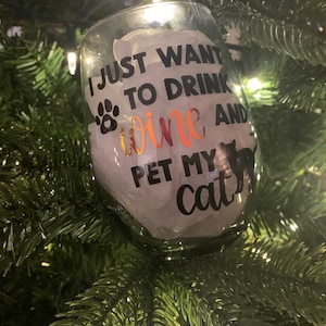 Drink wine and pet cat or dog - wine glass