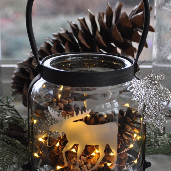 Metal and glass - etched "Moose" lantern.  Cabin/cottage owner favourite!