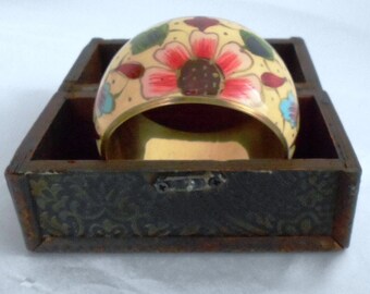 Vintage bracelet with floral enamel brass colored wide bracelet.