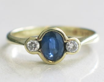 Oval Sapphire and Diamond Bezel Set 14K Yellow Gold Ring