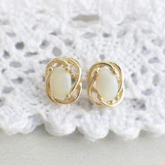 Oval White Opal Stud 14K Yellow Gold Earrings - image 1