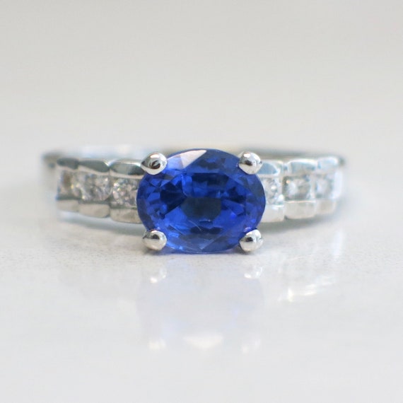 18K White Gold Oval Tanzanite Set East to West Wit