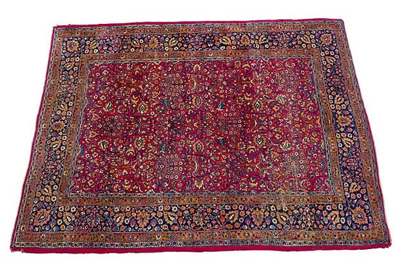 Antique Persian rug with floral design in rust, gold, and navy. Circa 1930. 139"L X104" W