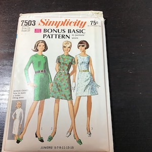 May include: Vintage Simplicity sewing pattern 7503 for junior sizes. The pattern features illustrations of three different dresses, including a green long-sleeve dress, a floral print dress, and a light blue dress. The pattern includes a bonus basic pattern.