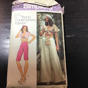 May include: Vintage Simplicity sewing pattern 5695 for Young Contemporary Fashion. The pattern features illustrations of a tie-front top and shorts, and a tie-front top with wide-leg pants. The pattern is size 10, bust 32 1/2 inches.
