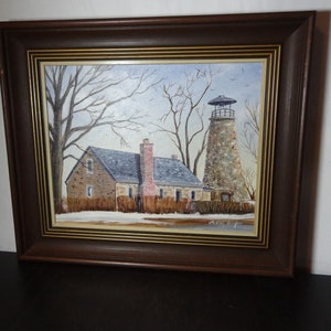 Vintage Wood Framed Oil Painting Rustic Stone House and Stone Lighthouse in Winter - by Artist Audrey Schafer - Original Signed Rustic Art