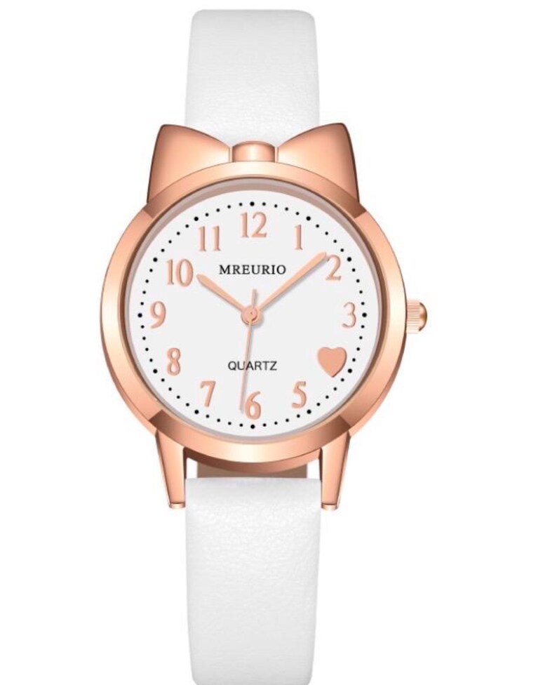 May include: A white wristwatch with a rose gold case and a white leather band. The watch face is white with black numerals and a heart at the 5 o'clock position. The watch has a bow-shaped top and the brand name "MREURIO".