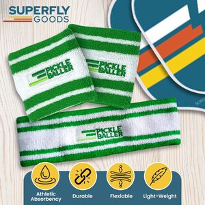 May include: White and green striped athletic sweatbands and a headband. The text "PICKLE BALLER" is embroidered on the items. The brand name "SUPERFLY GOODS" is at the top. The image also includes icons for athletic absorbency, durability, flexibility, and light-weight.