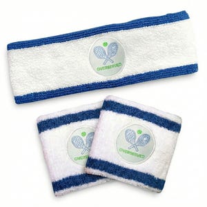 May include: White terry cloth tennis headband and wristbands with blue stripes. Each item features a circular patch with crossed tennis rackets, a tennis ball, and the word "OVERSERVED".