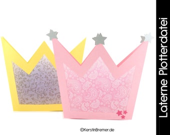 May include: Two paper crown lanterns, one yellow and one pink, with a white paisley pattern. The lanterns have silver stars on top.