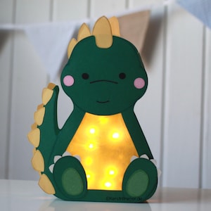 Mallar för pyssel med dinosaurielykta PDF SVG DXF plotterfil med hantverksinstruktioner för nedladdning | Dinosaurie Stegosaurus St. Martin's lykta DIY