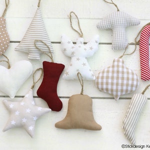 May include: A collection of handmade Christmas ornaments in various shapes, including a heart, star, angel, and bell. The ornaments feature patterns like polka dots, stripes, and gingham, in neutral colors with twine hangers.