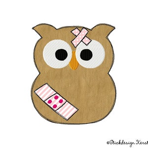 May include: A brown owl with large white eyes and a pink and white bandage on its head. The owl has a pink and white striped bandage on its wing.