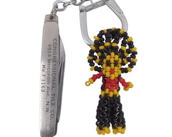 Portachiavi vintage anni '50 con perline a forma di seme di un nativo americano e piastrella del Congresso del Maryland.