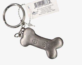 Portachiavi a forma di osso di cane in peltro Russ, vintage, nuovo, vecchio stock, Woof