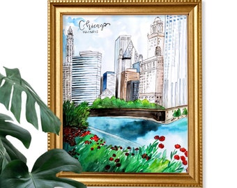 May include: A watercolor painting of the Chicago skyline with the text "Chicago, Illinois" at the top. The painting features tall buildings, a river, and green trees. The painting is framed in a gold frame.
