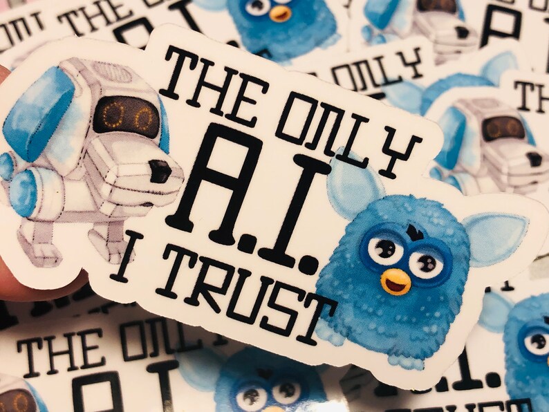 May include: A white sticker with a blue robot dog and a blue fuzzy toy with the text "The Only A.I. I Trust" printed on it.