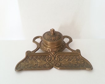 Brass inkwell with pen rest