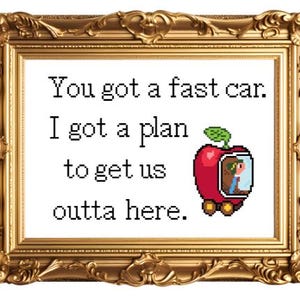 May include: A framed print with a gold frame and a white background. The print features a pixelated image of a red apple with a person inside, and the text "You got a fast car. I got a plan to get us outta here."