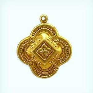 May include: A gold pendant with a detailed, ornate design. The pendant features a central diamond-shaped element with a floral pattern.
