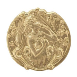 May include: A gold-toned metal brooch featuring a stylized Art Nouveau design of a woman with flowing hair and floral accents.