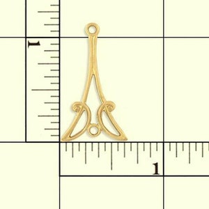 May include: Gold metal pendant with a decorative design. The pendant is about 1 inch tall.