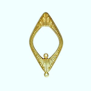May include: A gold-toned metal pendant with a diamond-shaped frame and intricate details. The pendant has a small loop at the bottom for attaching a chain.