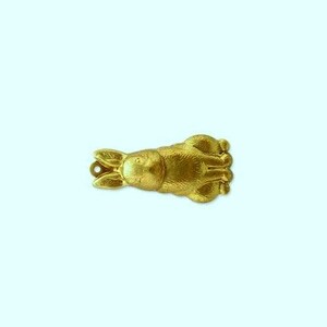 May include: A gold-colored metal charm in the shape of a rabbit lying down. The rabbit has a detailed design and is perfect for adding a touch of whimsy to jewelry or crafts.