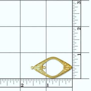 May include: Gold-toned metal frame with an ornate design. The frame is shaped like a teardrop and has a small loop at the top.