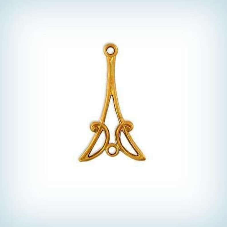 May include: A gold metal decorative stand with a round top and three legs. The stand has a delicate, ornate design.