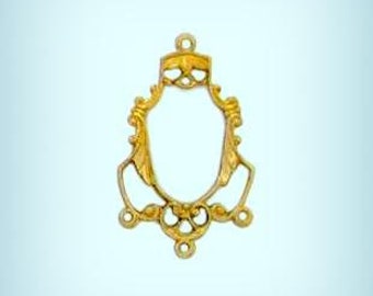 May include: Gold-toned metal pendant with a decorative frame and five loops. The frame is ornate and has a scalloped edge. The pendant is designed to hold a cameo or other decorative element.