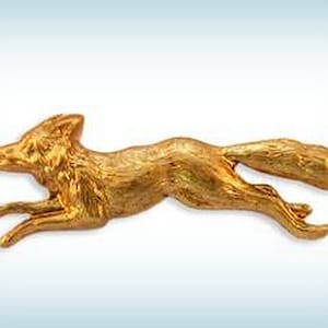 May include: A gold-colored fox figurine in a running pose. The fox is detailed with fur and has a long, bushy tail.