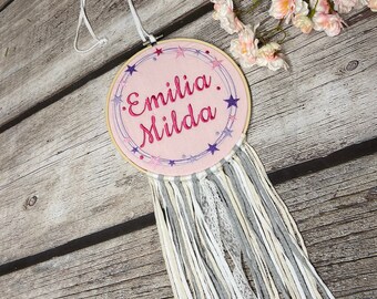 Door sign with name, in embroidery frame