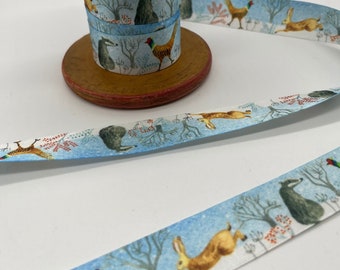 2 metres of Christmas frosty morning 25 mm wide ribbon. Featuring woodland animals badgers, foxes, deer. Perfect for present wrapping.