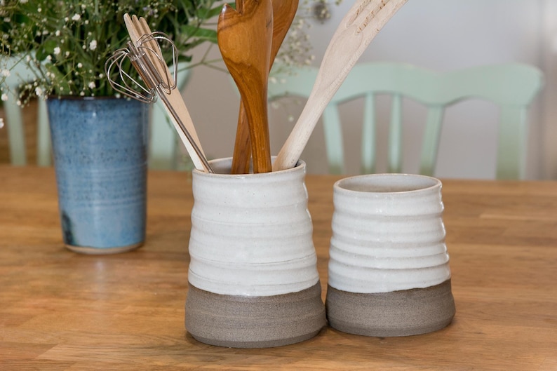 Handcrafted French country crock with grooves, showcasing wheel-thrown artistry