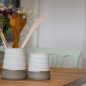 Pair of rustic crocks perfect for kitchen storage or as a centerpiece