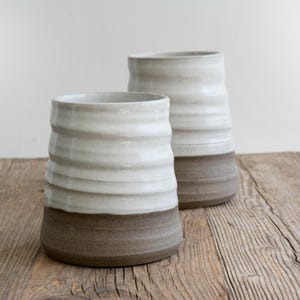 Close-up of grooves on a handcrafted crock, revealing artisan craftsmanship