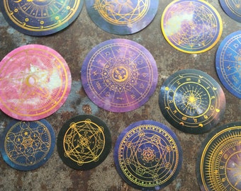 Mystical cosmos stickers with gold foil sun, moon and star sign zodiac symbols for celestial and galaxy themed journaling or scrapbooking