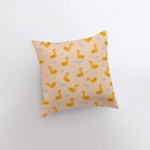 a pillow with a rubber ducky pattern on it