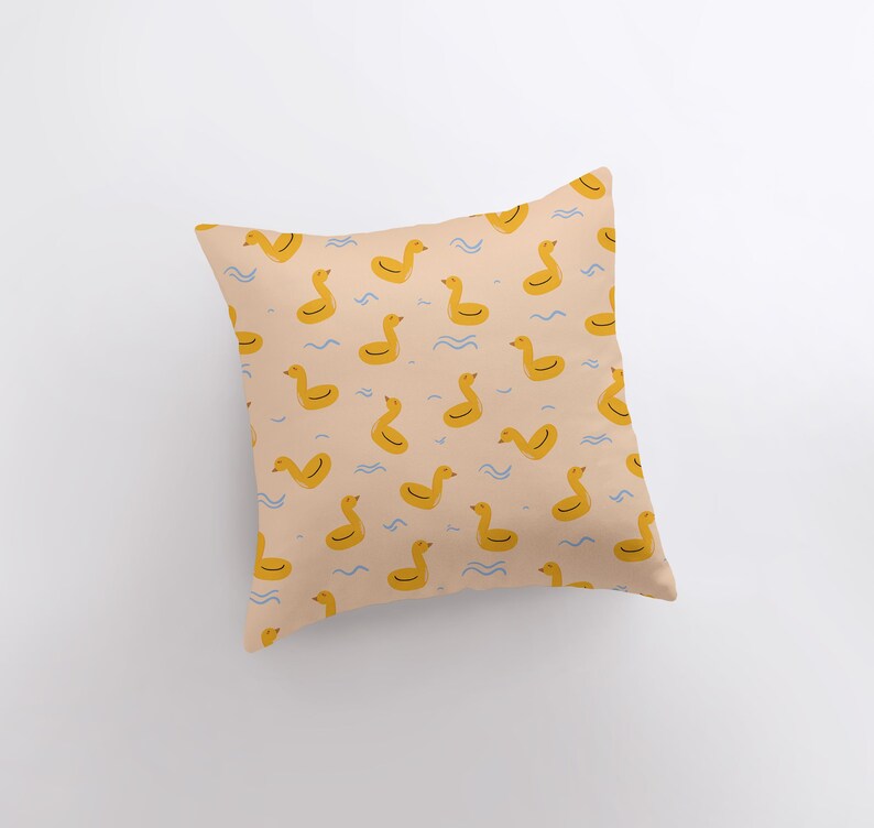 a pillow with a rubber ducky pattern on it