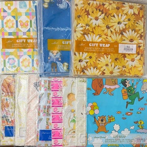 May include: Assortment of colorful gift wrap paper sheets with various patterns, including floral, geometric, and cartoon designs. The sheets are packaged in plastic and labeled with the text "Gift Wrap" and the size of each sheet in feet.