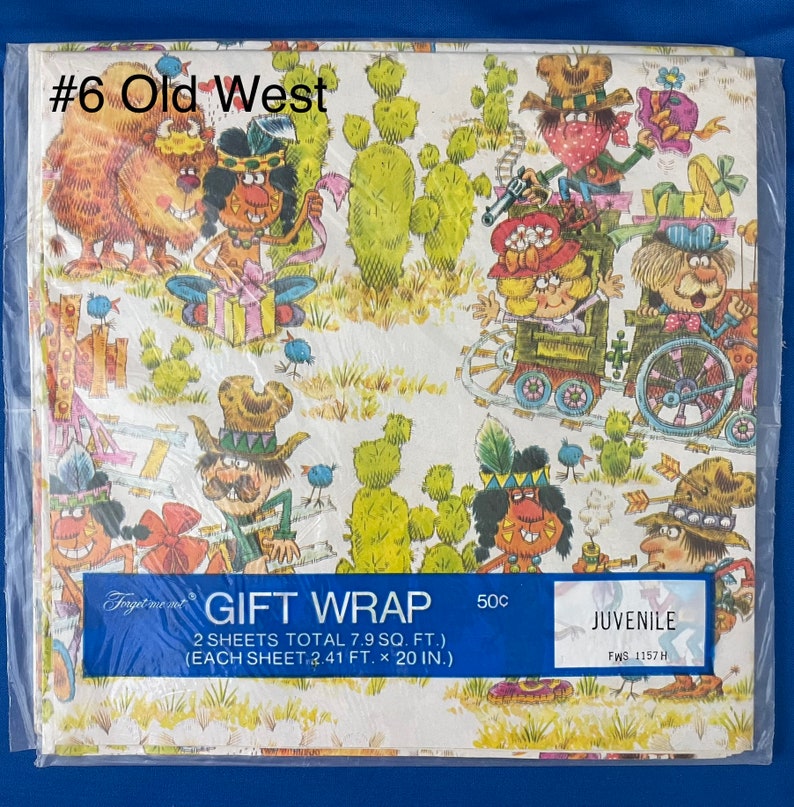 May include: A vintage gift wrap featuring a cartoon illustration of cowboys and Native Americans in a Western setting. The paper is white with a yellow and brown pattern. The text on the paper reads "Gift Wrap 2 sheets total 7.9 sq. ft. (each sheet 2.41 ft. x 20 in.) 50c Juvenile FWS 1157 H".