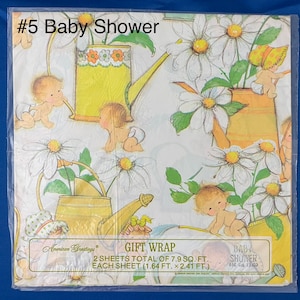 May include: Baby shower gift wrap featuring a white background with a repeating pattern of yellow watering cans, daisies, and babies. The text "#5 Baby Shower" is in the top left corner. The text "GIFT WRAP" is in the center of the image. The text "BABY SHOWER" is in the bottom right corner. The text "2 SHEETS TOTAL OF 7.9 SQ. FT. EACH SHEET (1.64 FT. x 2.41 FT.)" is in the center of the image.