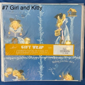 May include: A blue and white gift wrap with a girl and a kitten. The wrap features a girl reading a book, a girl looking at a bird in a birdhouse, and a girl with a kitten. The text on the wrap reads "Gift Wrap", "2 sheets total of 7.9 sq. ft.", "Each sheet (1.64 ft. x 2.41 ft.)", "All Occasion", "LN 3463D", and "Wishing you blue skies".