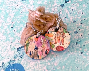May include: A pair of round wooden earrings with a colourful Disney theme. The earrings feature characters like Tinkerbell, Mickey Mouse, and Chip and Dale. The earrings are on a light blue background.