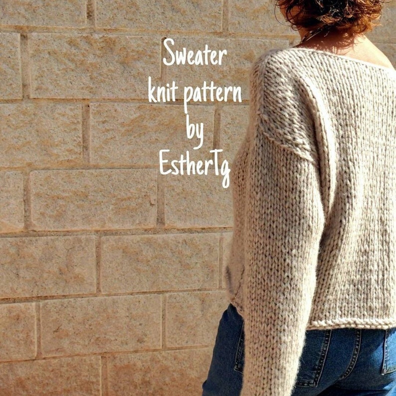 May include: A beige knitted sweater with a loose fit and long sleeves. The sweater has a slightly dropped shoulder and a relaxed neckline. The text "Sweater knit pattern by EstherTg" is visible in the image.